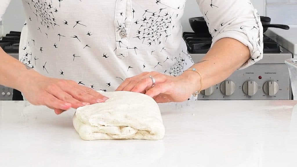 doing a letter fold on bread dough
