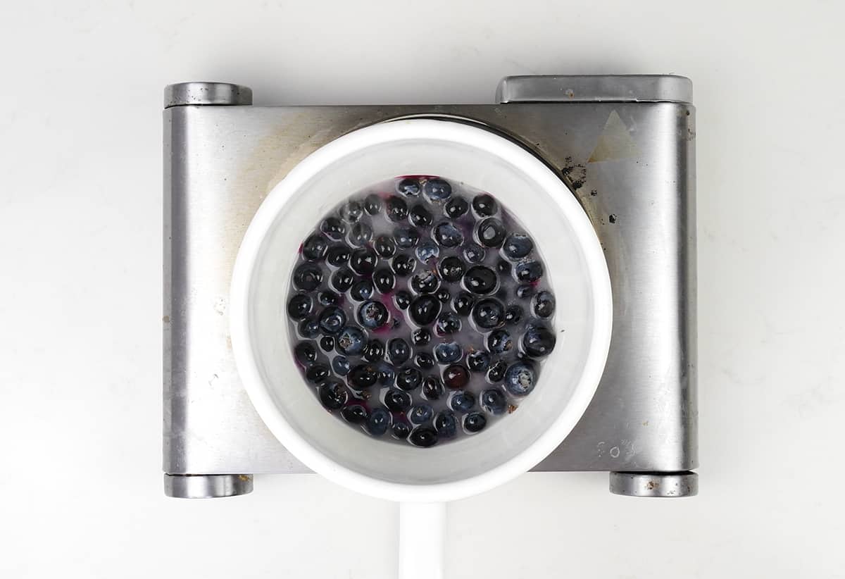 blueberries in a white pot with sugar and lemon juice