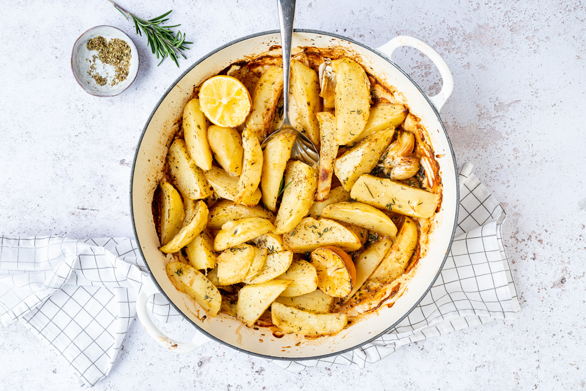 casserole with roasted potato wedges seasoned with oregano and thyme