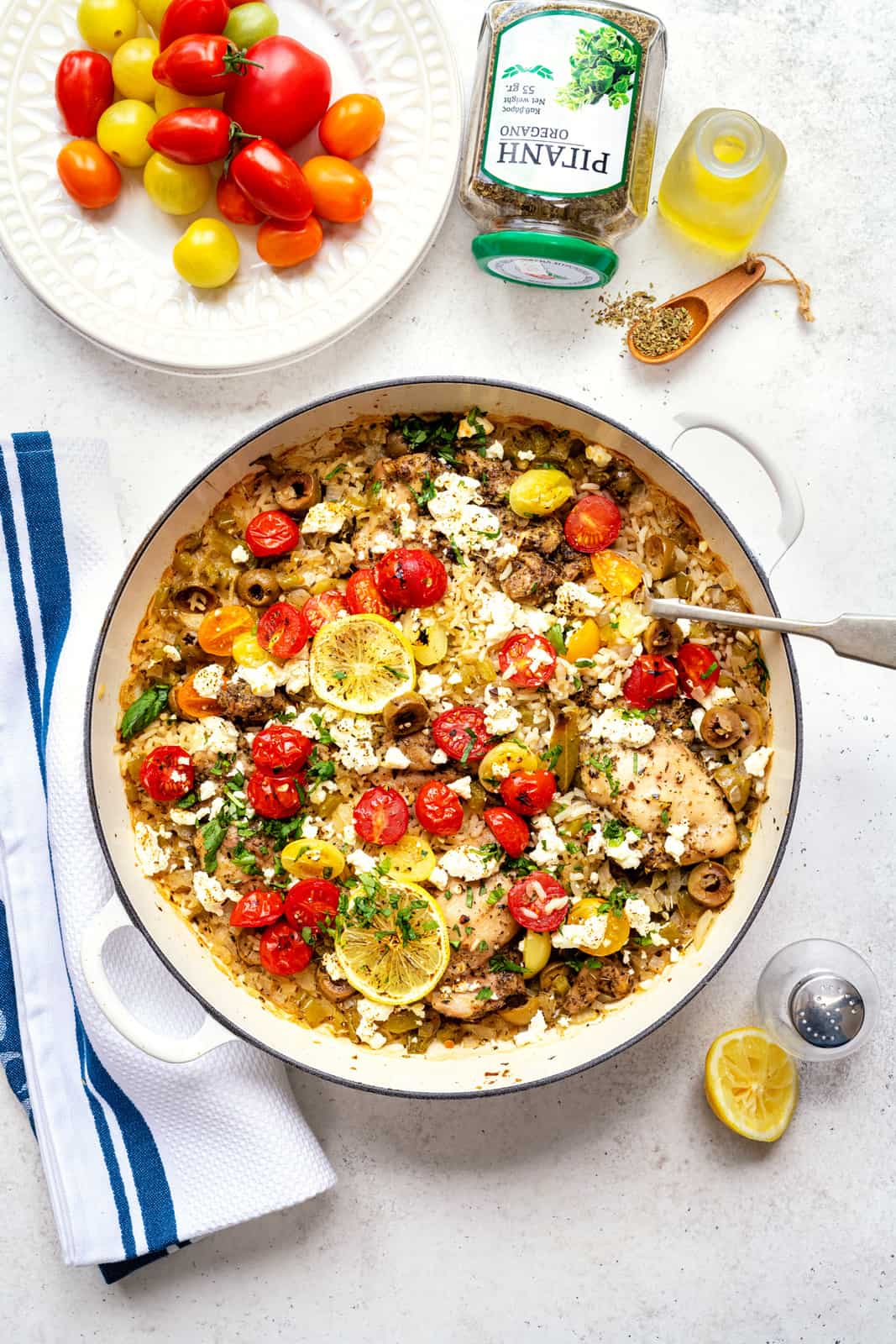 Greek chicken and rice casserole with olives, tomatoes, pepper and feta