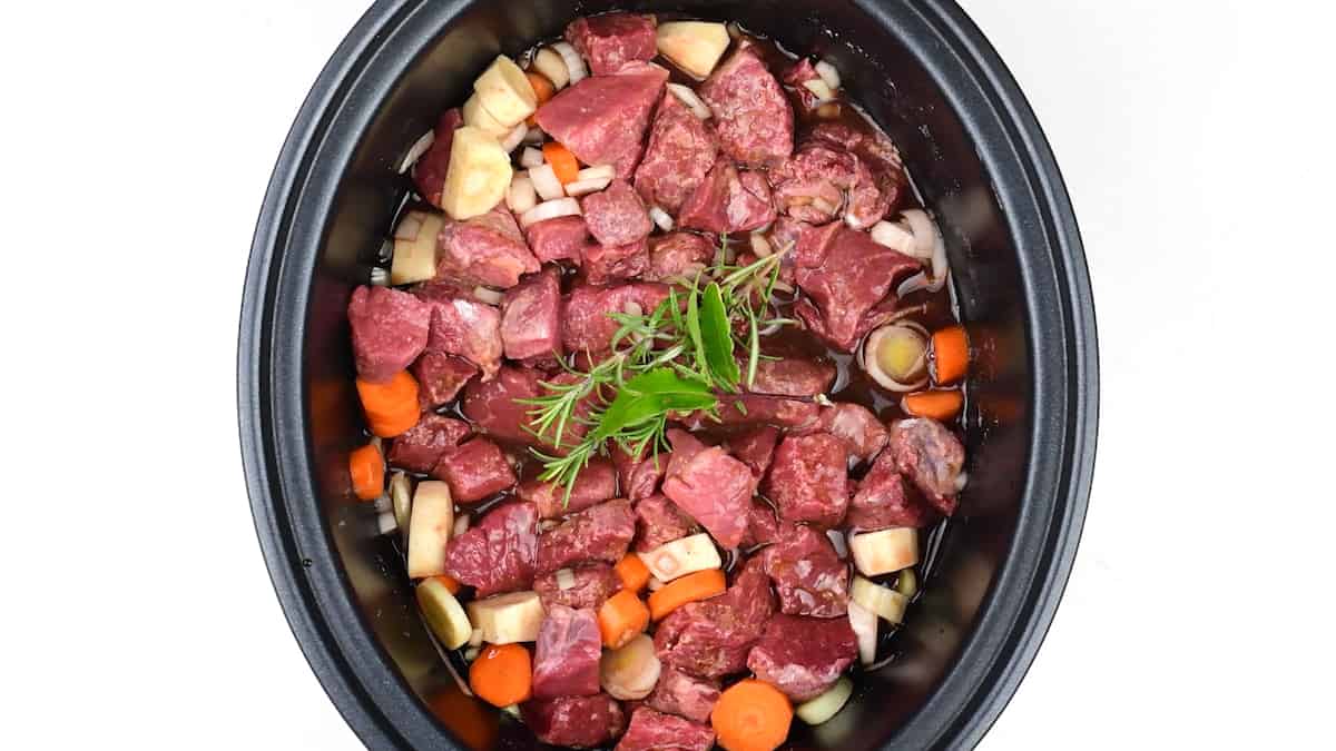 Beef stew ingredients in a crockpot