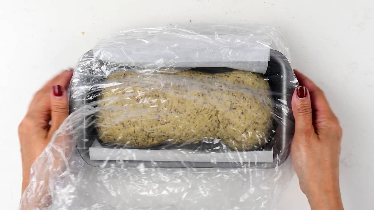 Covering keto bread dough with plastic bag to prove