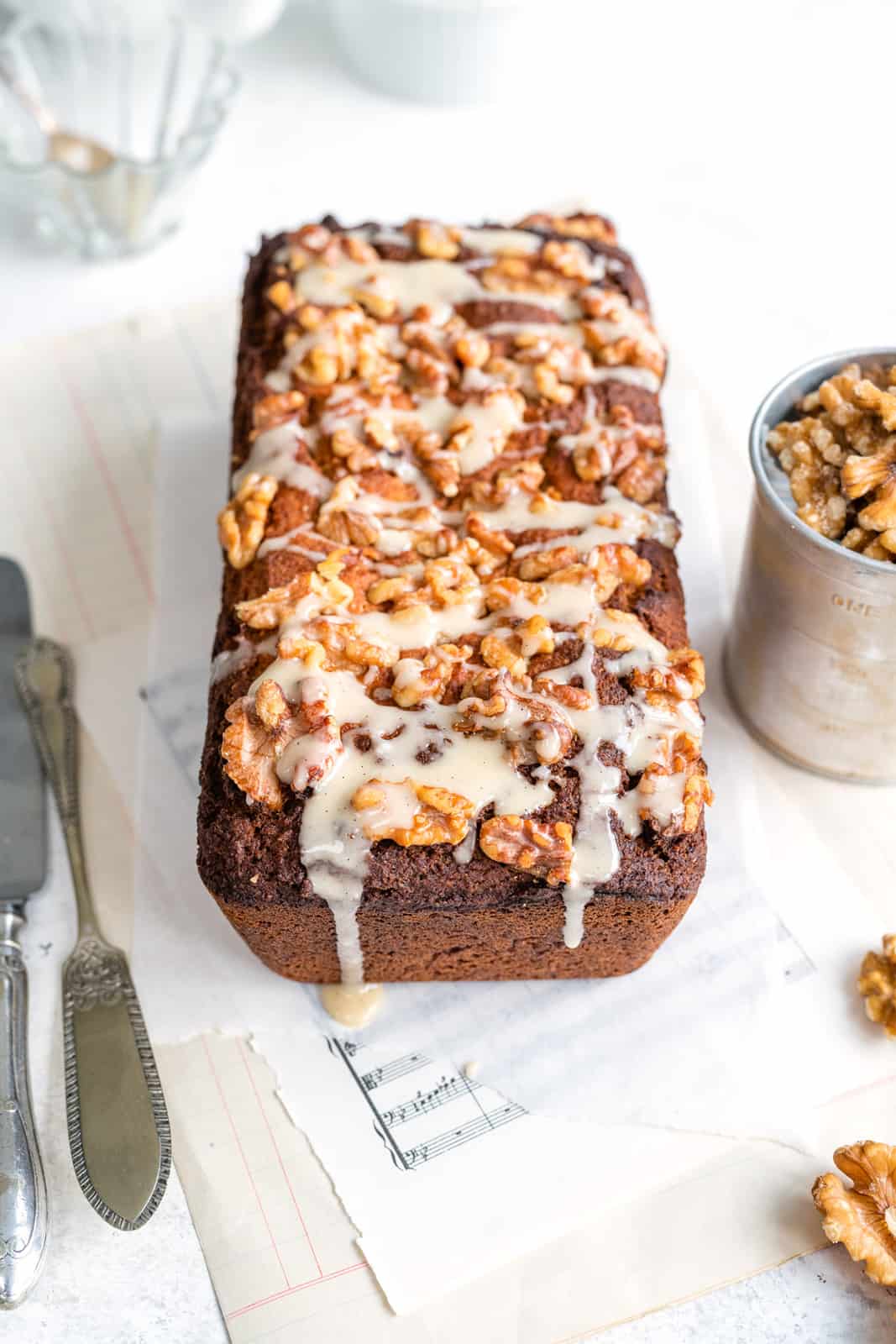 gluten free banana bread topped with walnuts and glaze