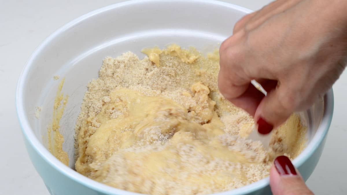 Mixing banana bread batter in a bowl