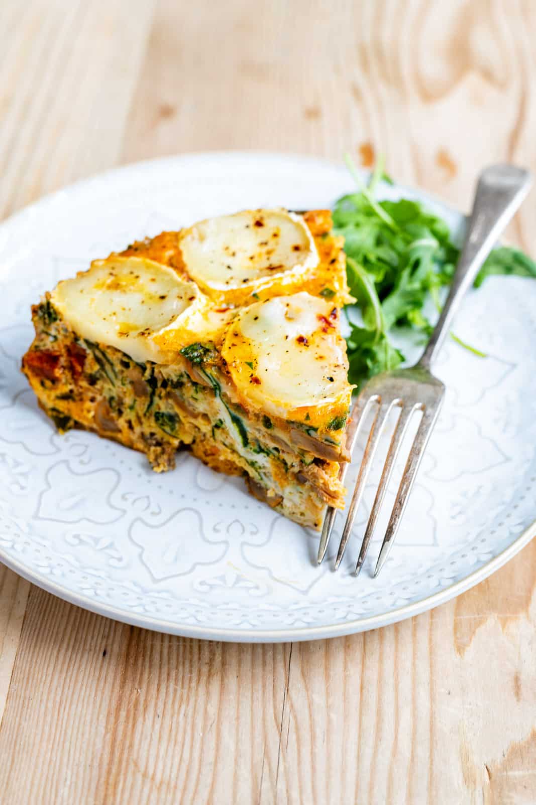 slice of Keto crustless quiche on a plate