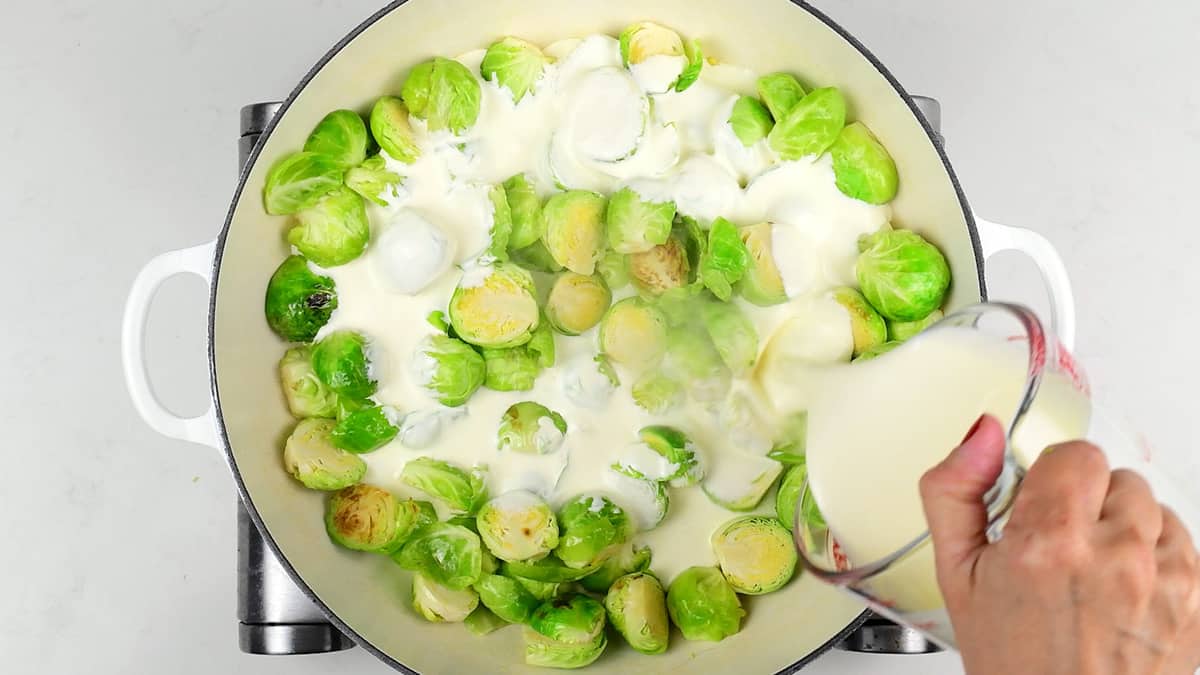 Adding cream to pan of Brussels Sprouts