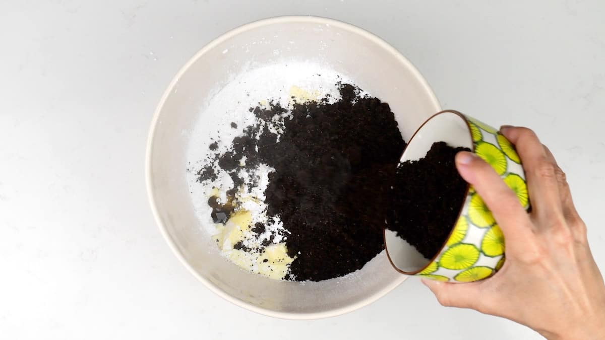 combining ingredients for Oreo frosting in a mixing bowl