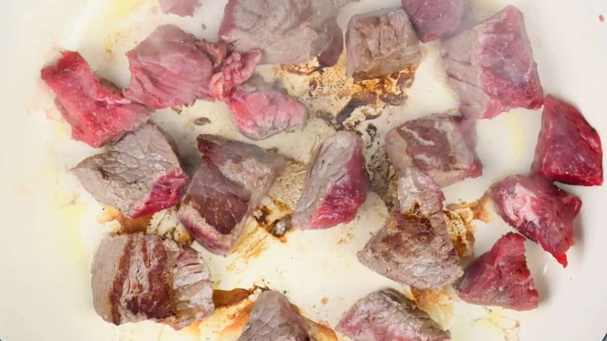 searing chuck steak in a casserole