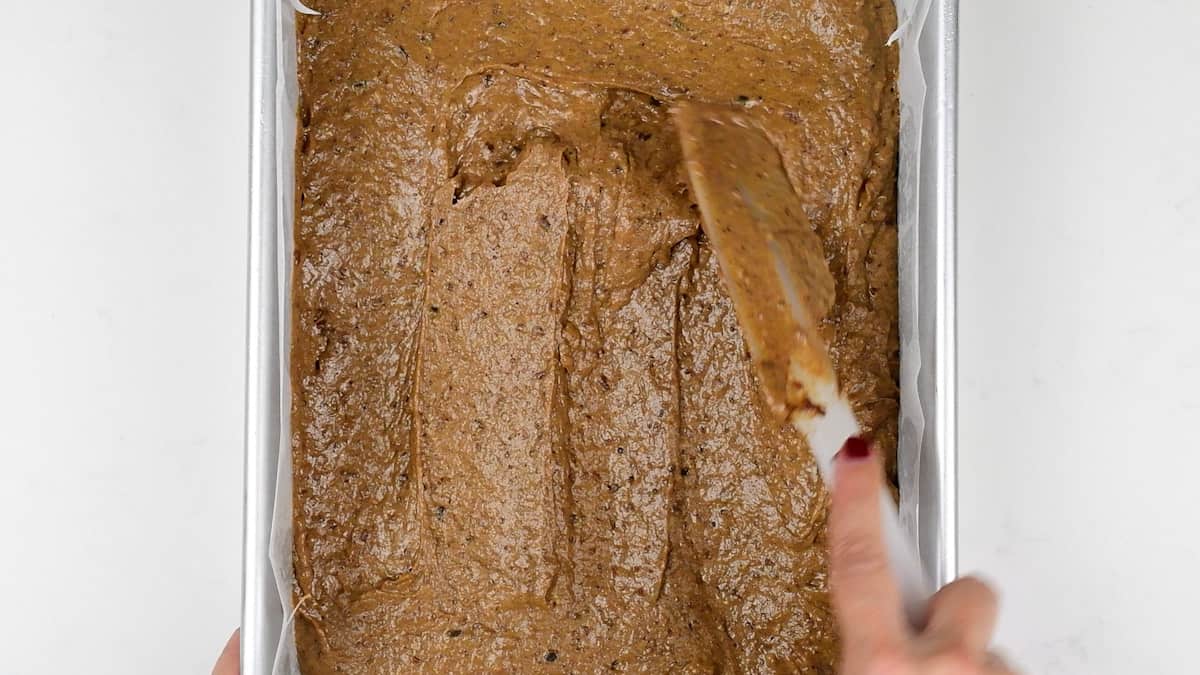 spreading toffee pudding batter into a rectangular cake pan