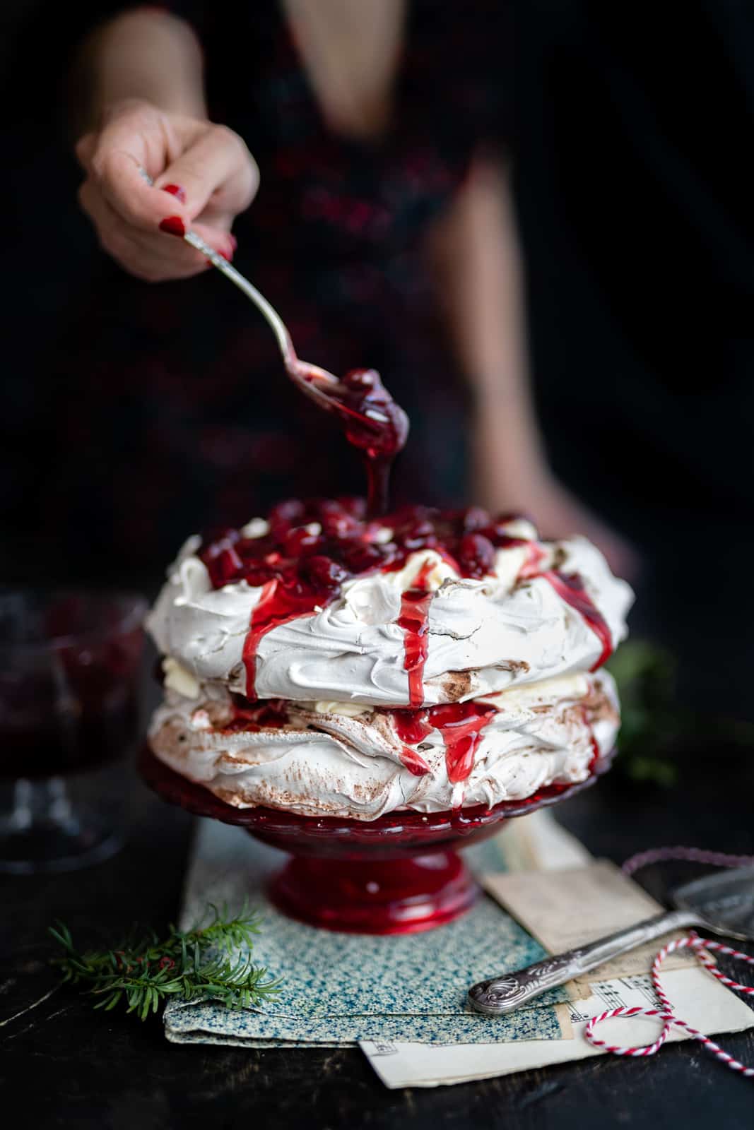Pavlova cake with cream and cherries