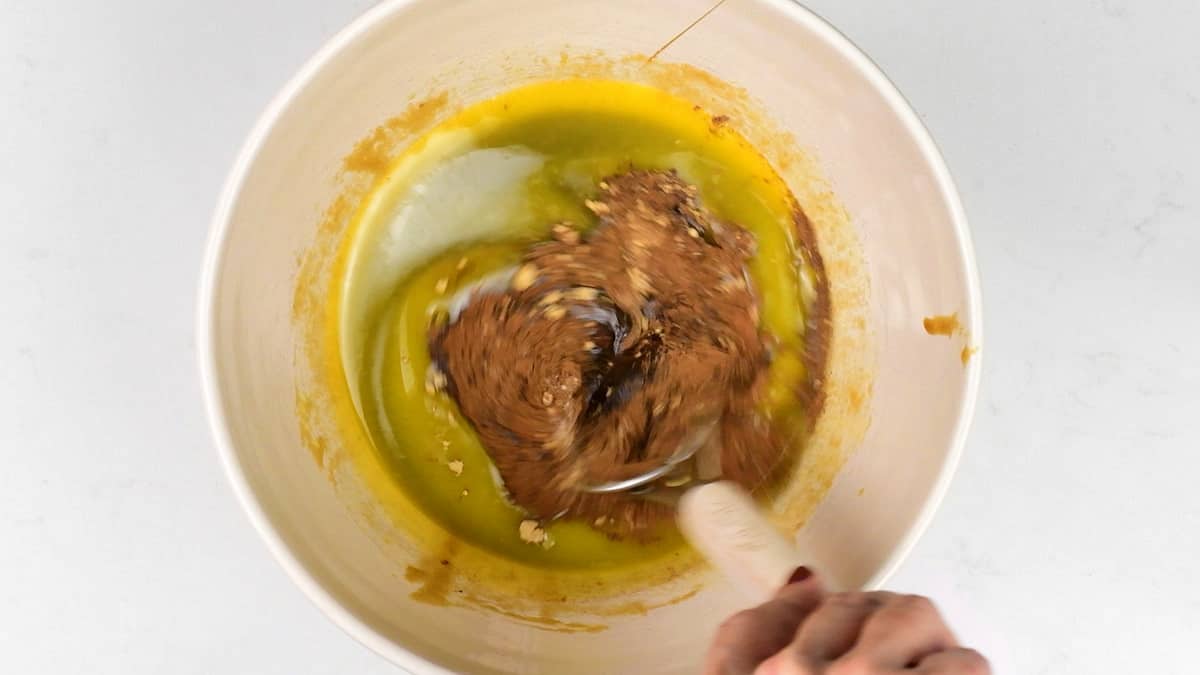 mixing spices into cookie dough batter