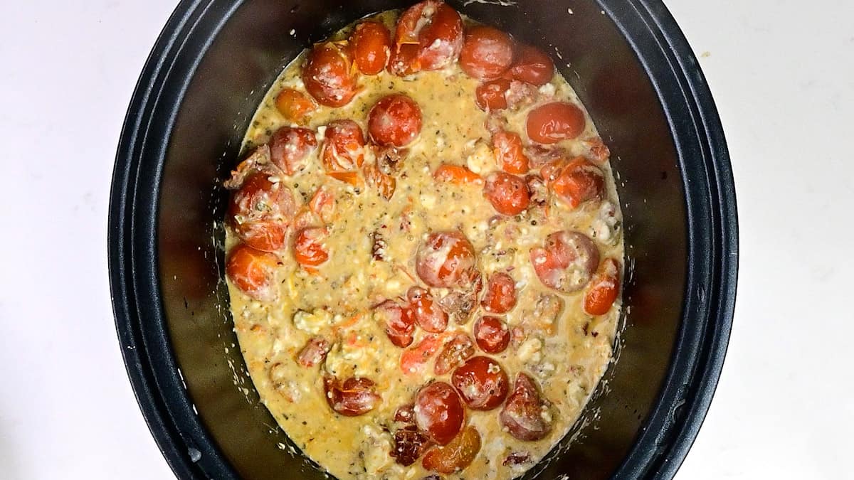 Baked feta and cherry tomatoes in a slow cooker