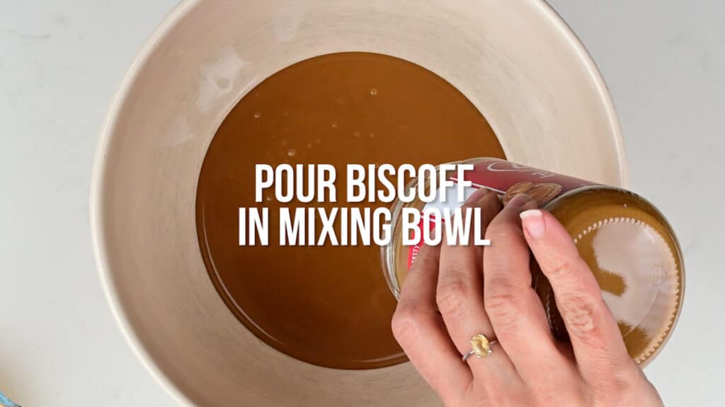 Pouring contents of Biscoff spread into a mixing bowl