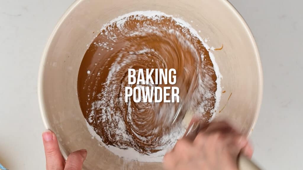 Mixing Biscoff spread and baking powder in a bowl