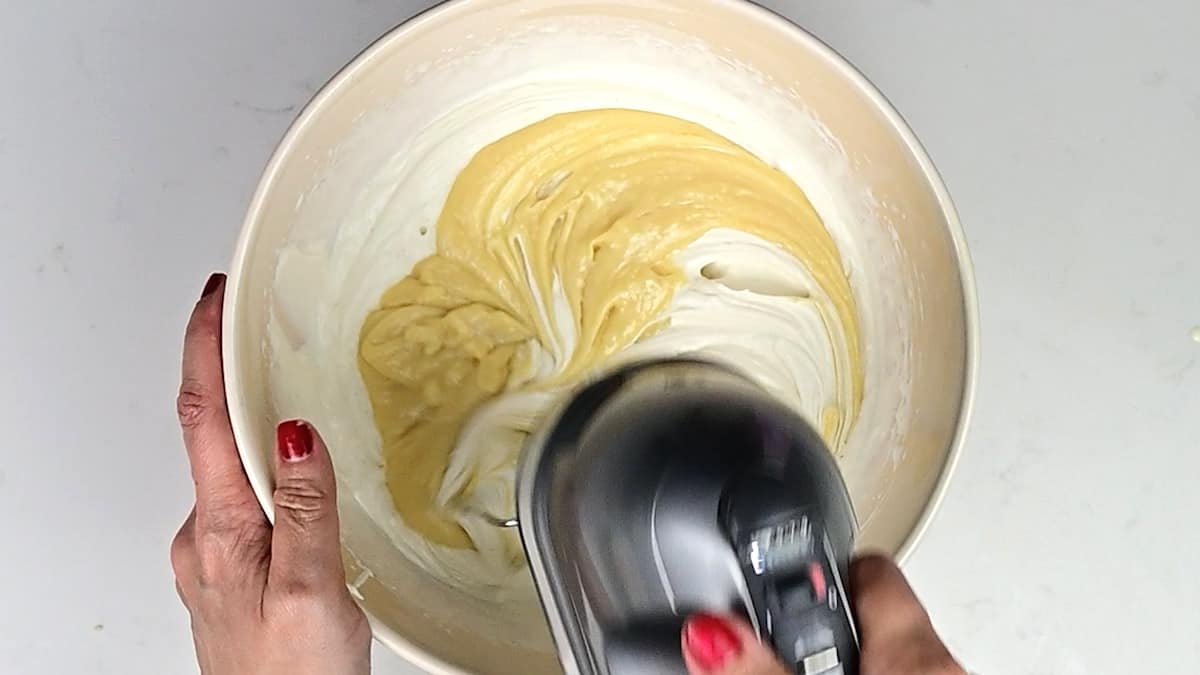 white chocolate cheesecake filling in a mixing bowl