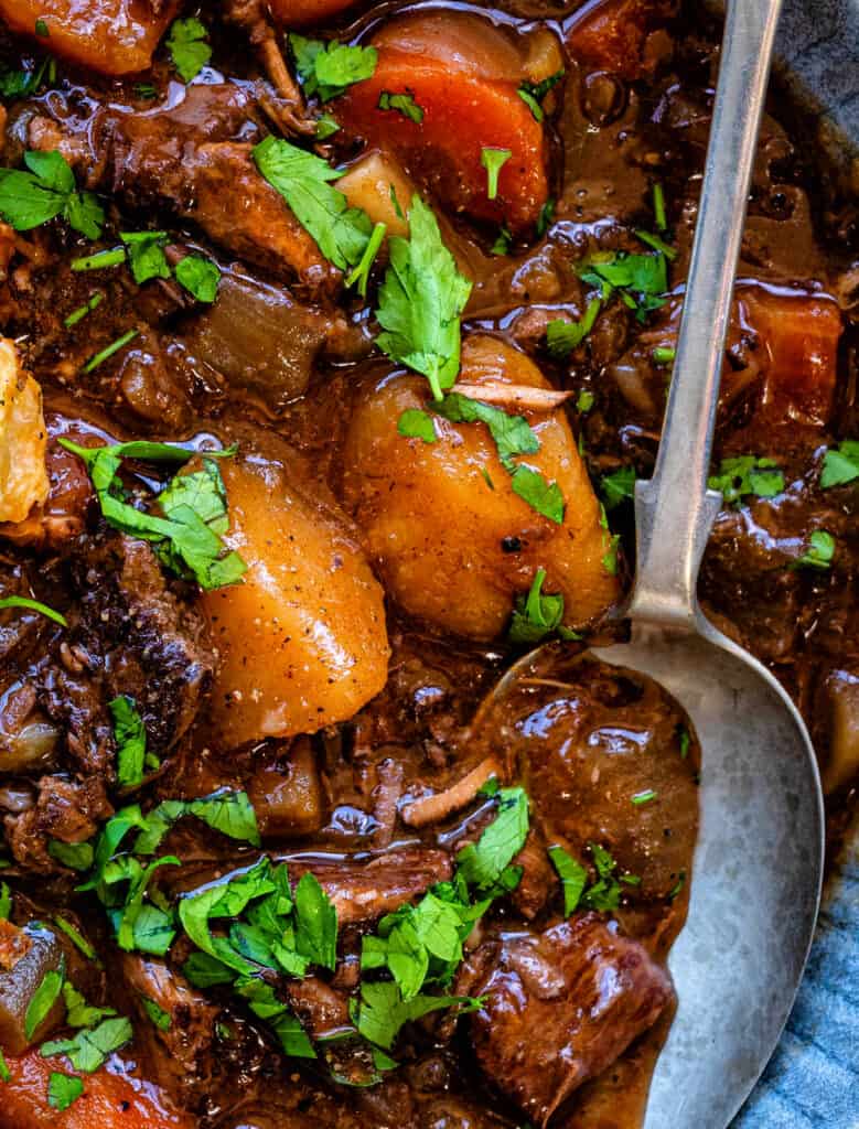 Close up on beef stew with potatoes, carrots and red wine gravy