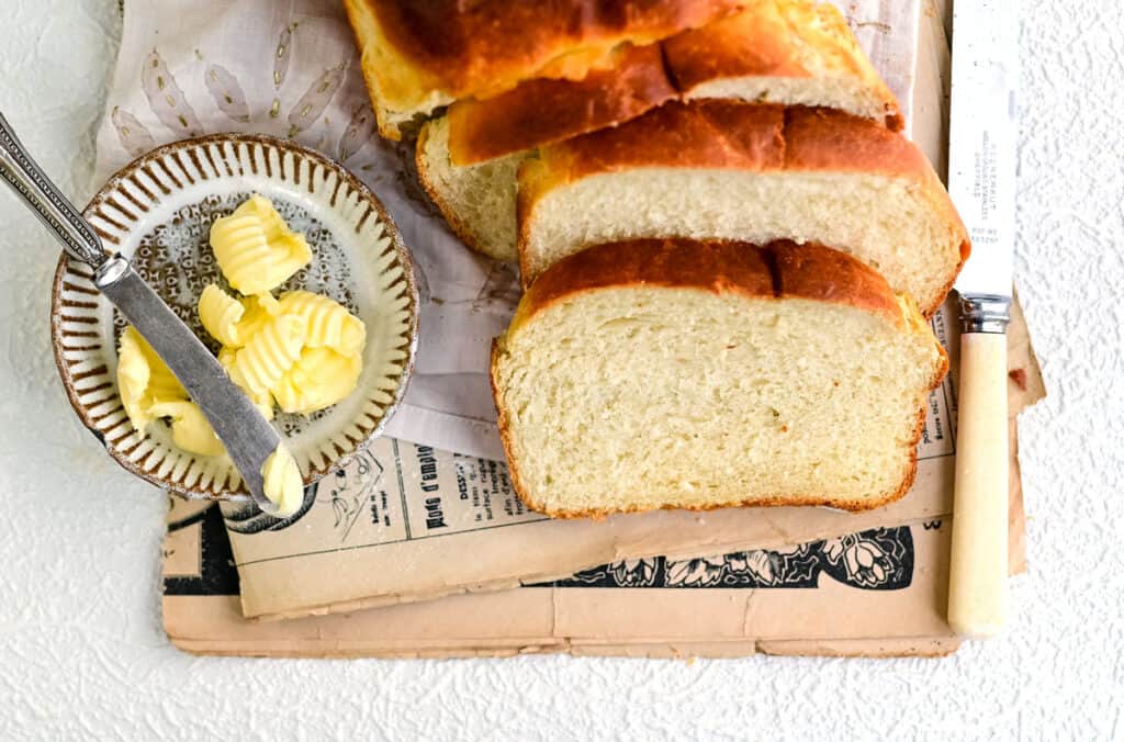 Milk bread sliced with butter on the side