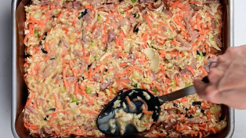Spreading Okonomiyaki batter in a rectangular pan