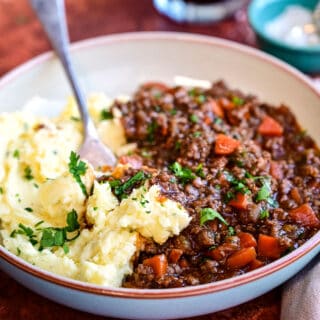minced beef in gravy served with mashed potatoes