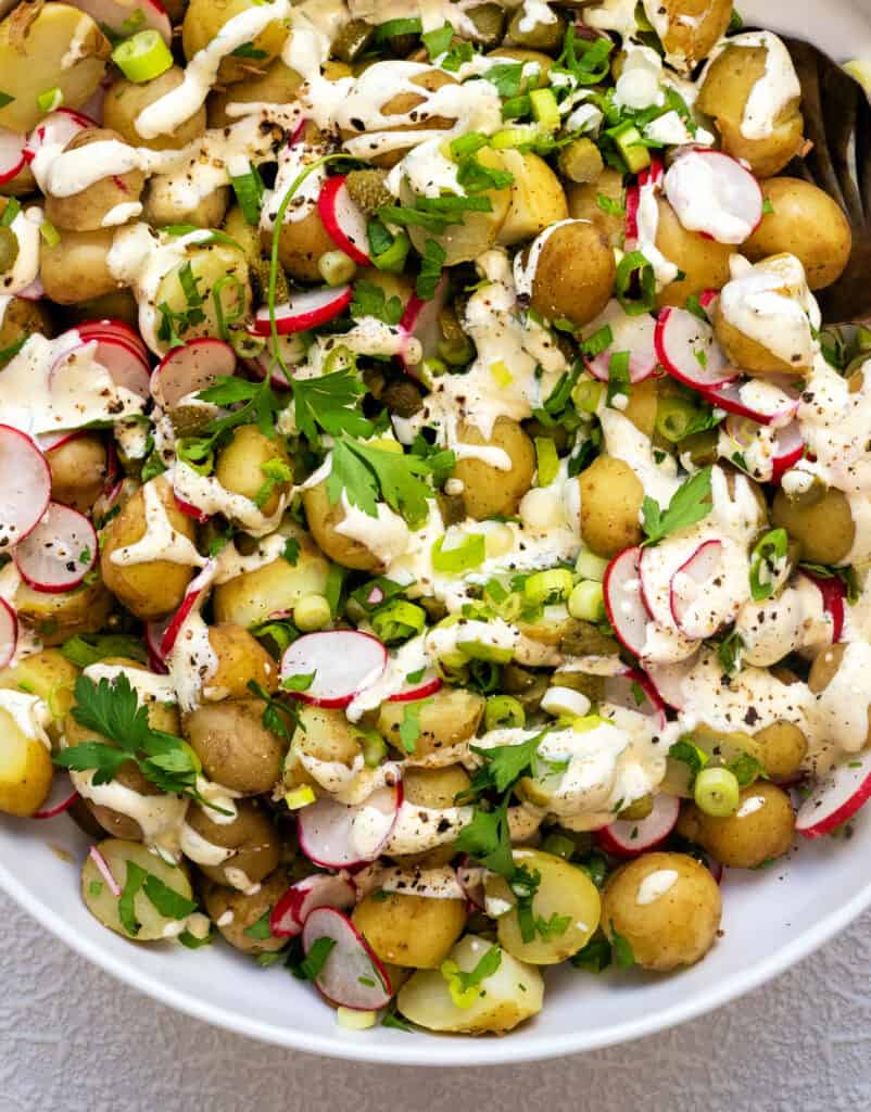 close up on new potato salad with healthy creamy dressing