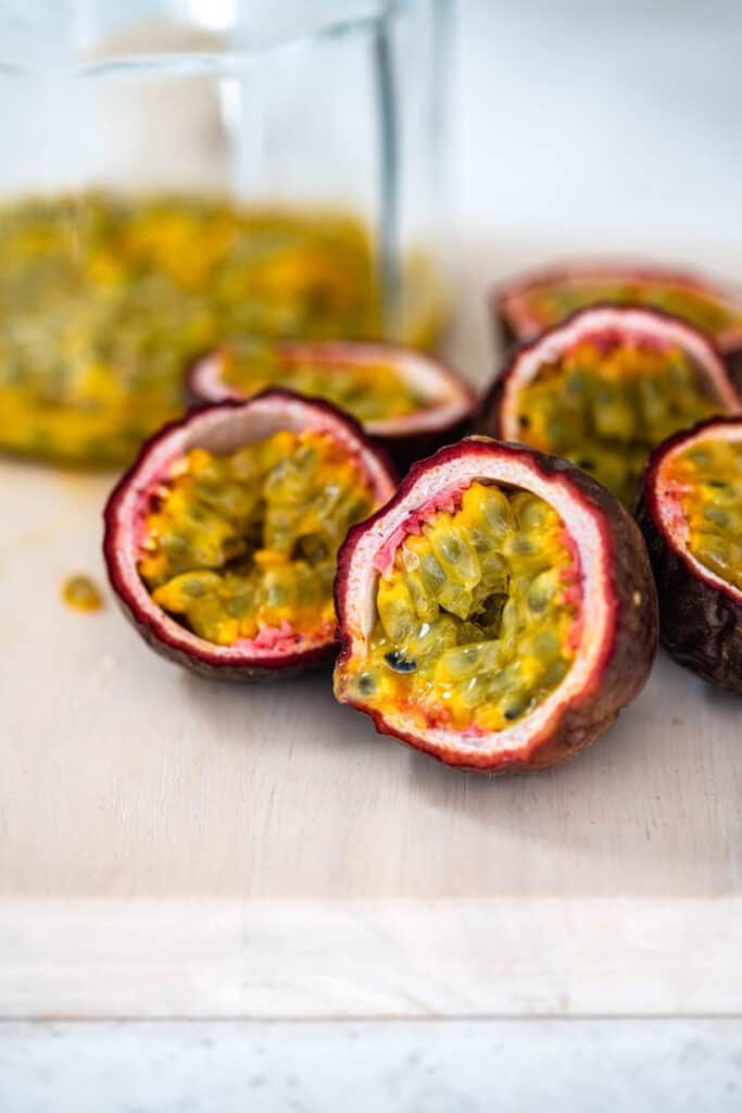 sliced passion fruit on a cutting board