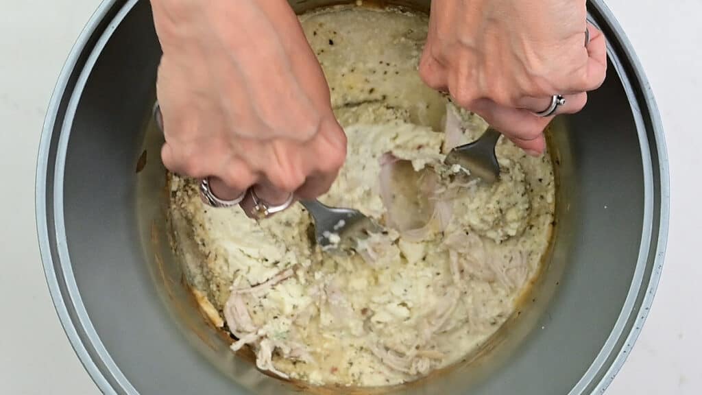 shredding chicken in a slow cooker