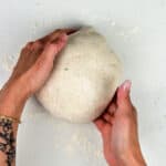 shaping sourdough loaf into a boule shape