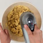 Beating butter and sugar with an electric hand mixer