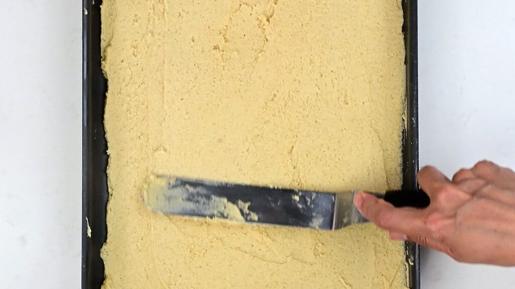Spreading batter into a rectangular baking pan