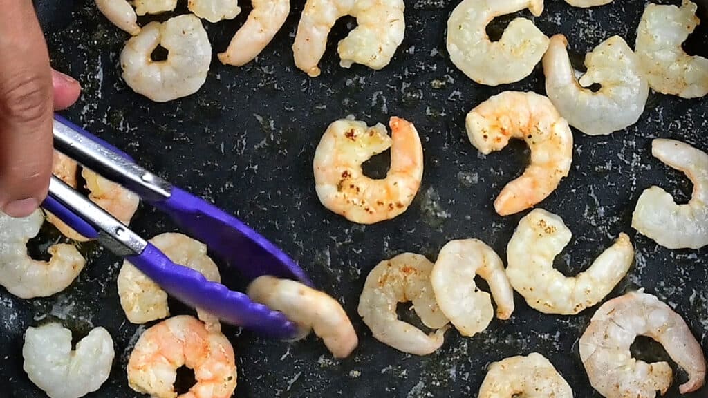 Pan frying shrimp in a skillet