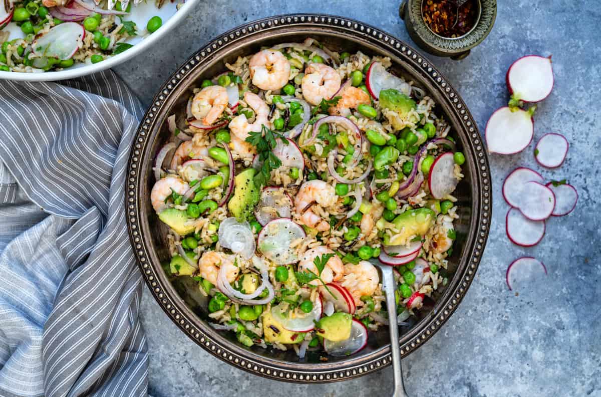 shrimp salad with avocado and rice in a bowl