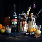 Baileys Freakshake on dark background with Halloween themed toppings