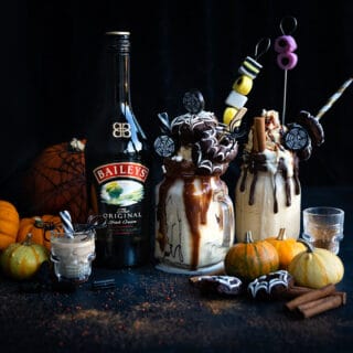 Baileys Freakshake on dark background with Halloween themed toppings