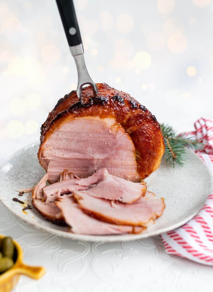 Slow Cooker Gammon Joint glazed and sliced on a platter
