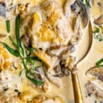 close up on a pan of tarragon chicken with cream and mushrooms