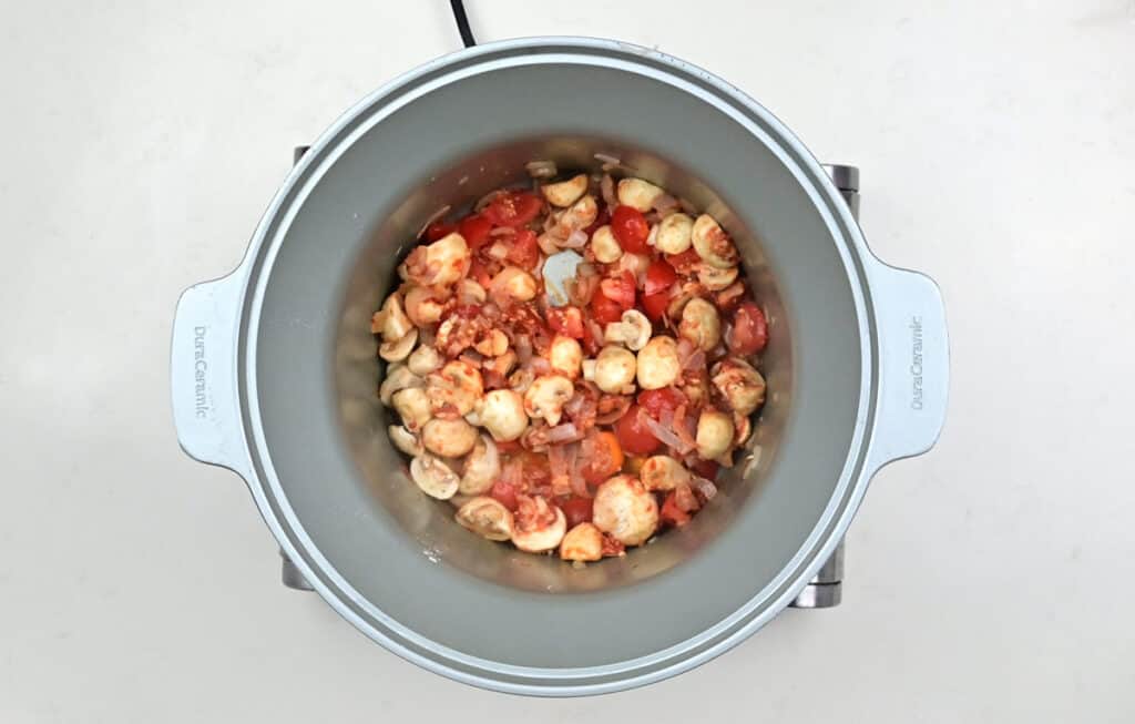 Mushrroms, shallots and tomatoes in a crockpot