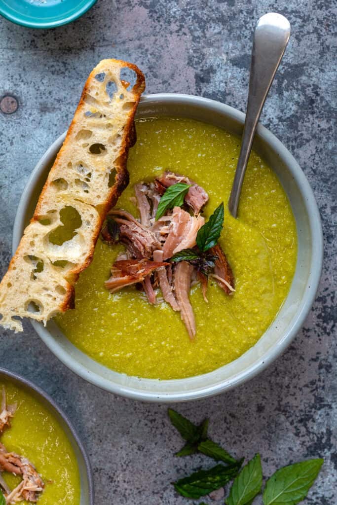 Close up on pea and ham soup in a bowl