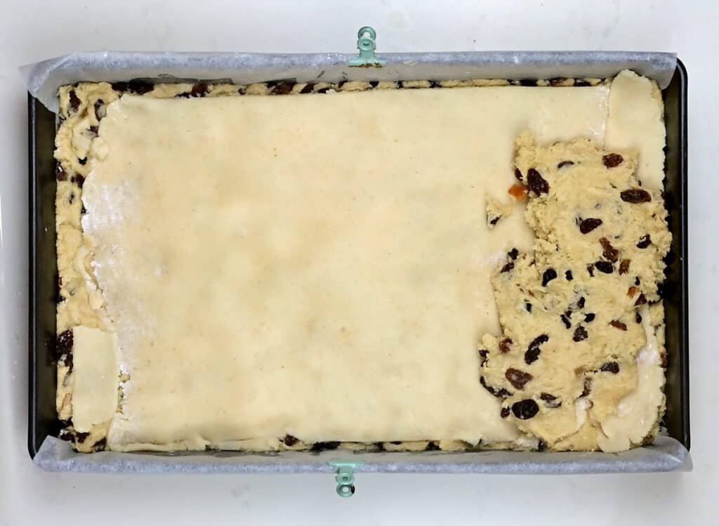 Topping stollen dough with rolled out marzipan