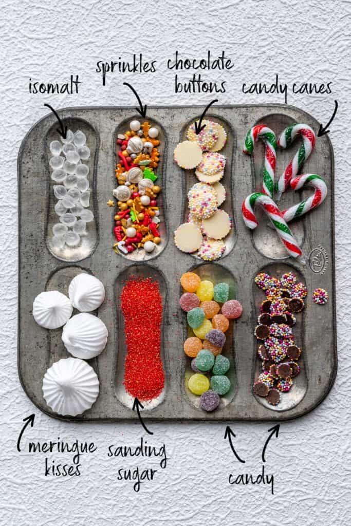 Assortment of candy, sprinkles, chocolate buttons for decorating a gingerbread house