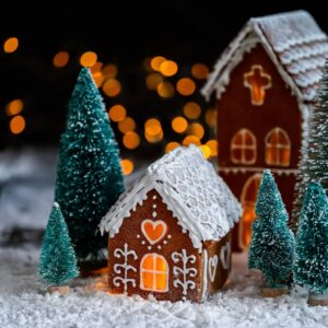 Gingerbread house with bottle brush trees and festive lights