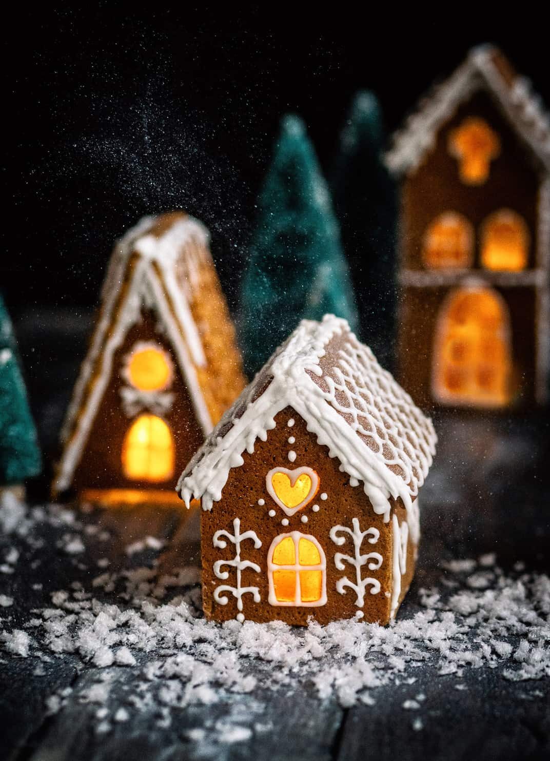 Gingerbread houses with bottle brush trees and festive lights