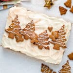 Gingerbread traybake with mascarpone frosting topeed with gingebread christmas tree cookies
