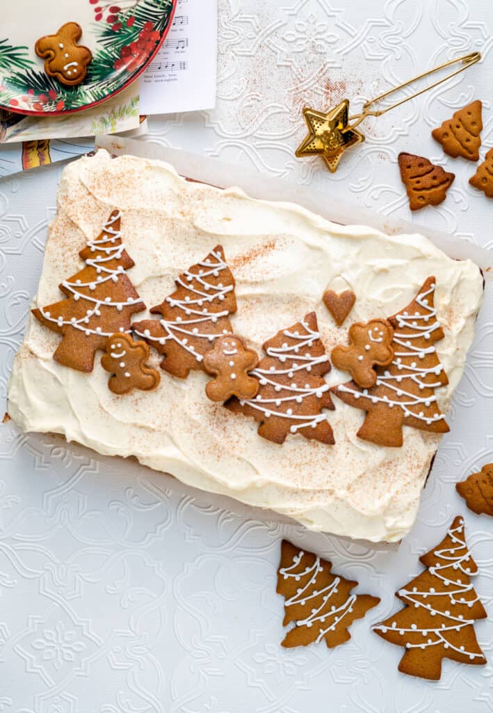 Gingerbread traybake with mascarpone frosting topeed with gingebread christmas tree cookies