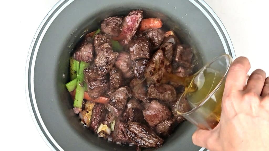 Adding beef to slow cooker beef stew