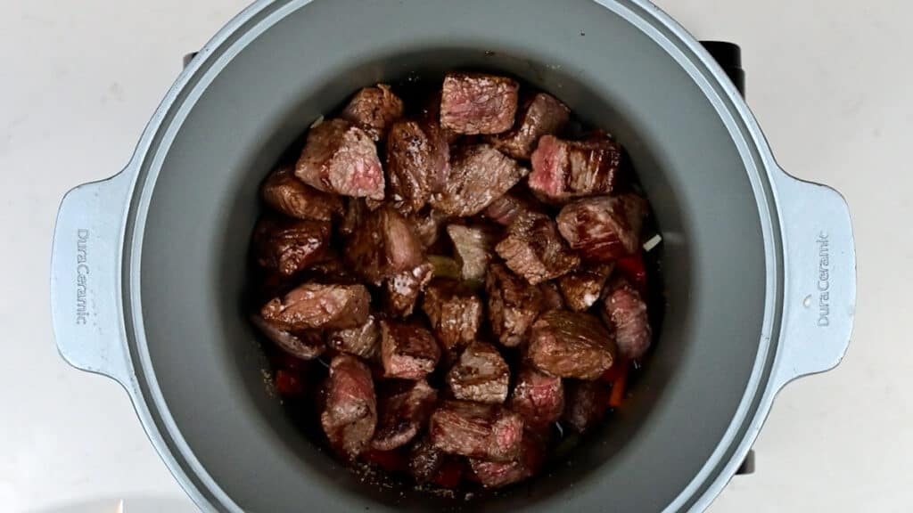 Beef cooking in a slow cooker