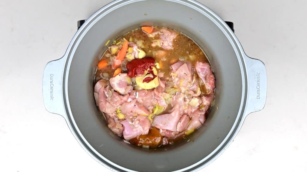 Bowl of crockpot chicken stew with dumplings