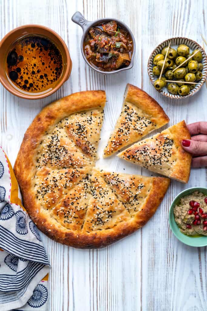 Overhead photo of Turkish bread with two slices cut