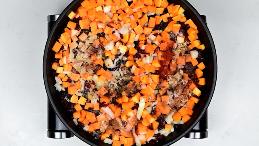 squash, onion and spices in a skillet