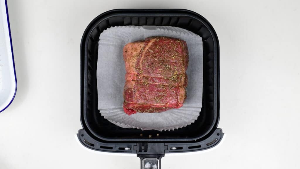 Small beef joint in the basket of an air fryer