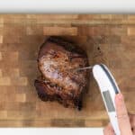 Checking beef roast internal tempeature with an instant read thermometer
